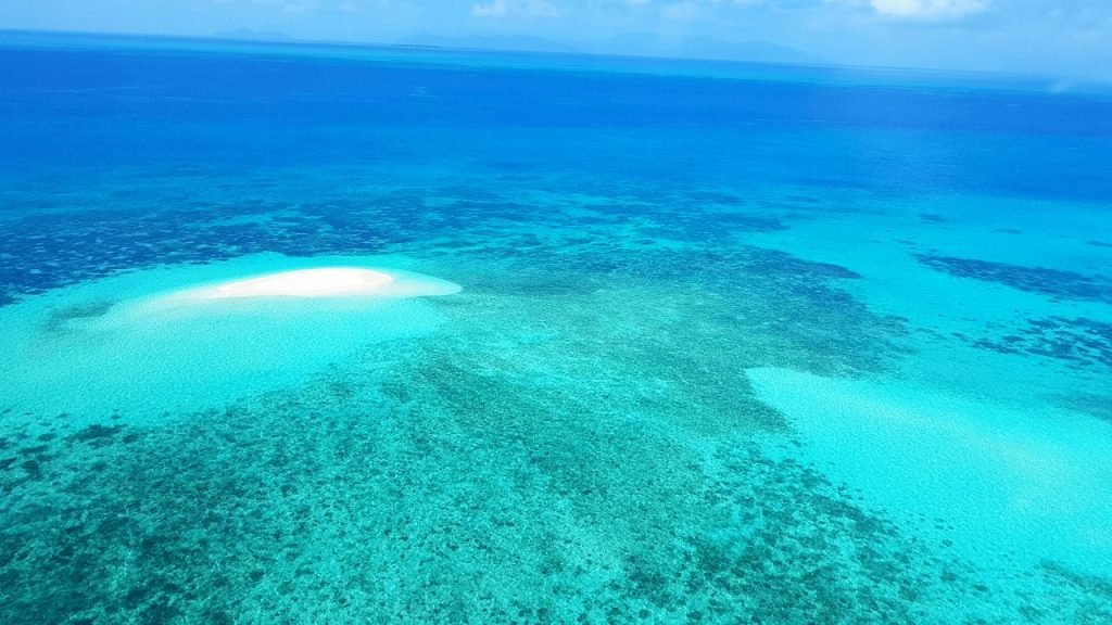 Helicopter view of sand cay at reef off of Cairns