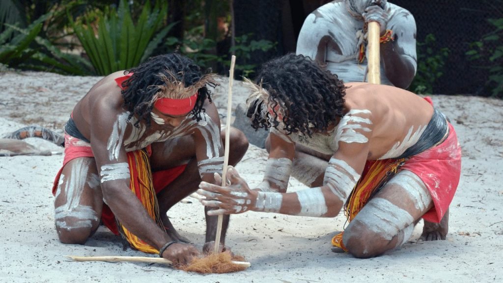 aborigital men starting a fire with sticks in Cairns